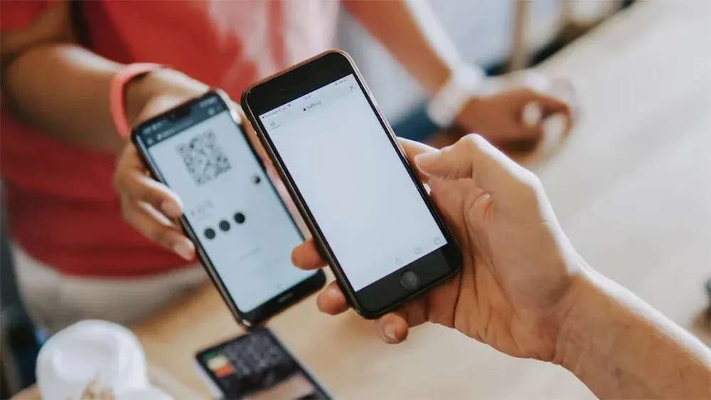 A QR-Code being scanned from a phone in a shop