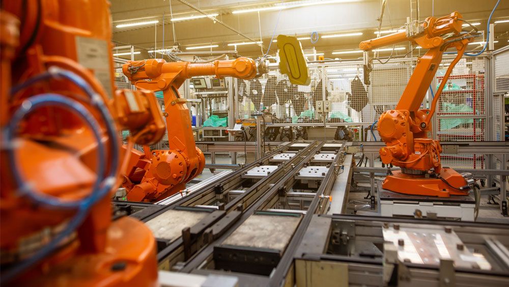 Welding industrial robots in a parcel locker factory