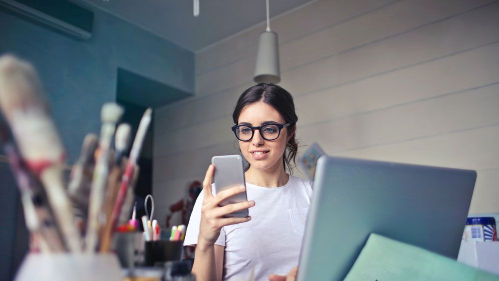 a woman holding a phone