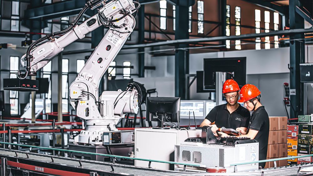 two workers in a factory
