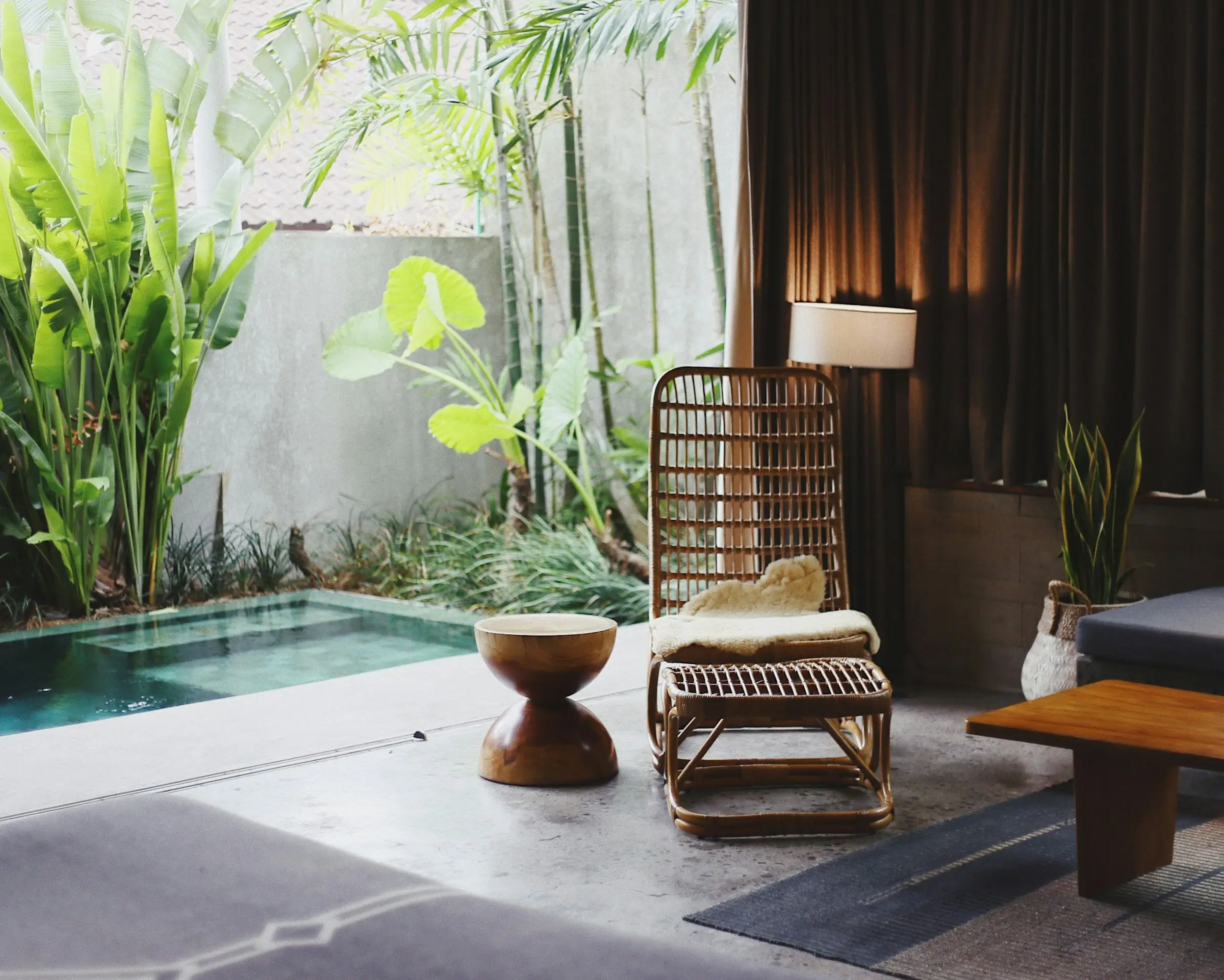 A quiet villa courtyard with a plunge pool at golden hour