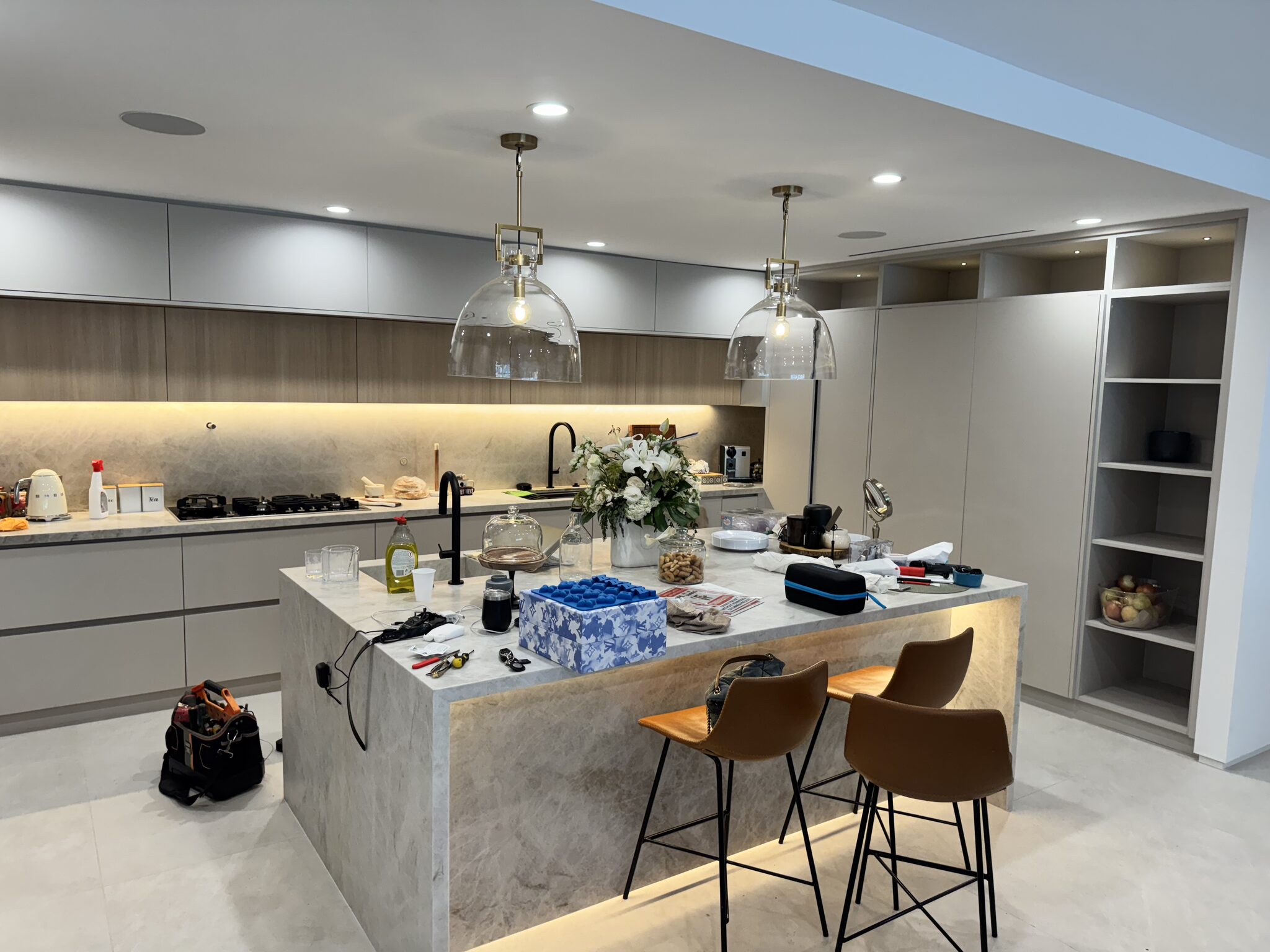 Modern kitchen with double pendant lighting and recessed cans