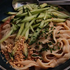 Hand pulled peanut noodles with cucumber, chives and crushed peanuts at Uncle Chen in Munich
