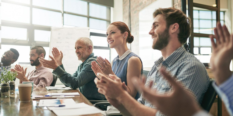 This picture shows a group of marketers celebrating because they turned project failure into marketing successes.