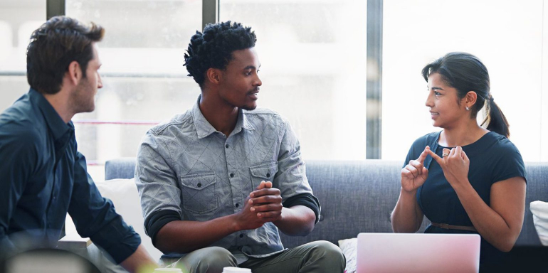 This picture shows a marketing agency account manager talking with clients and using some common phrases that should be avoided.