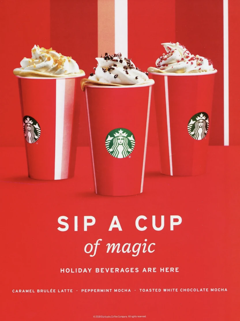 The image shows a screenshot of Starbucks Christmas ad campaign