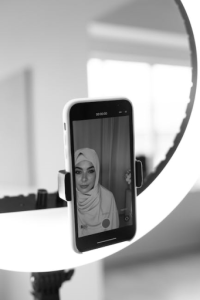 A Woman Using A Smarphone Camera