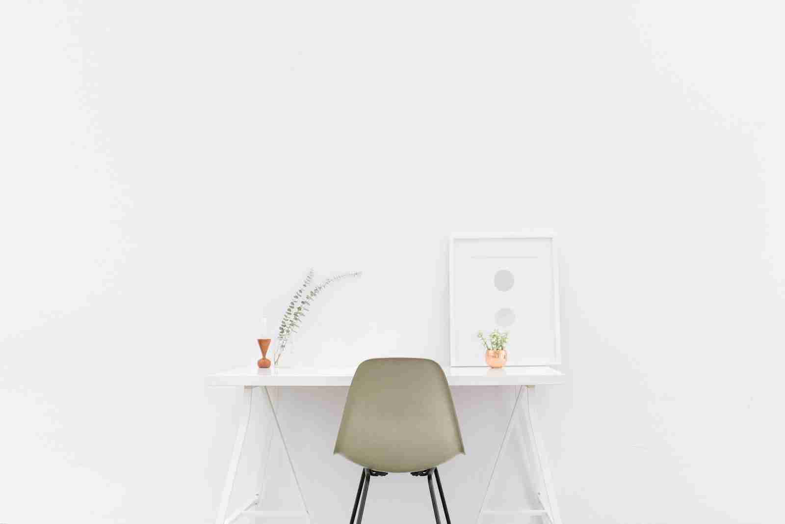 white wooden table near brown chair