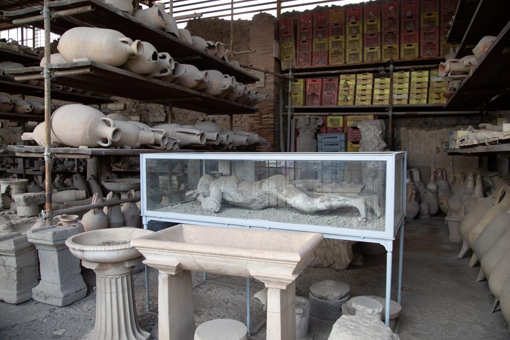 Italy, Pompeii, store-room with various bowls, amphorae, and Plaster casts of victims1