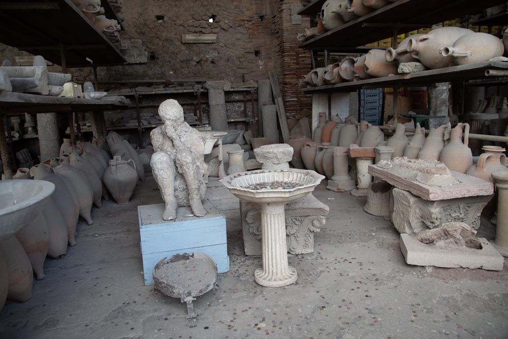 Italy, Pompeii, store-room with various bowls, amphorae, and Plaster casts of victims3