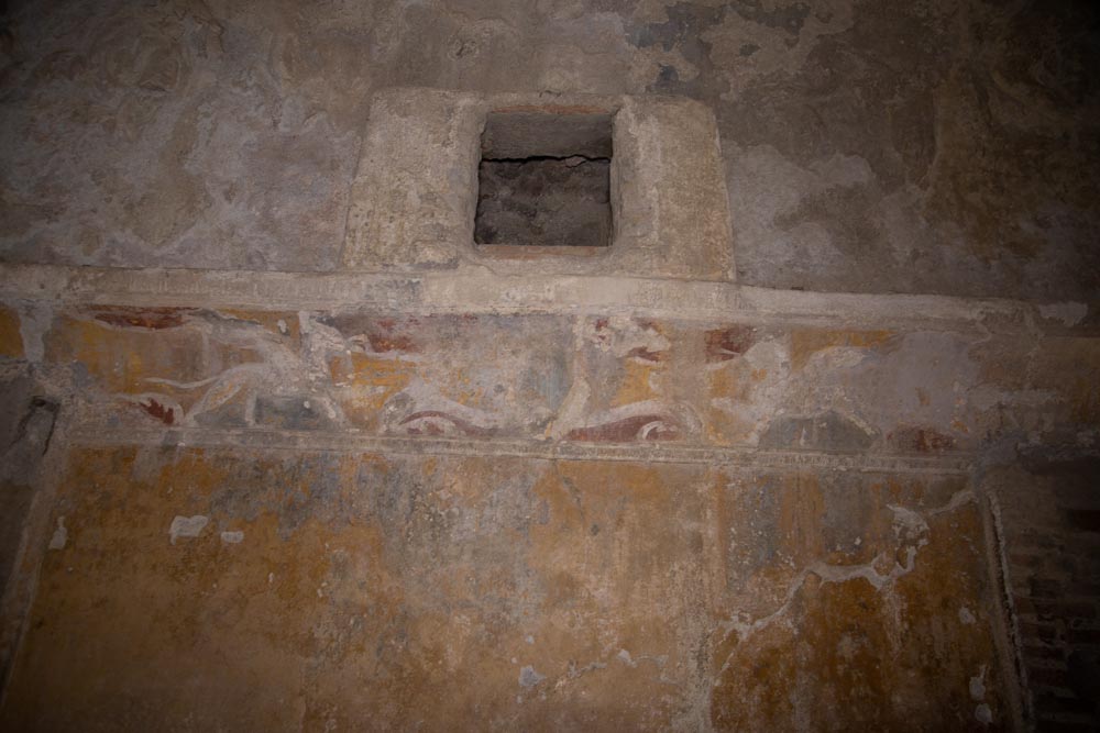 Italy, Pompeii,Forum Baths, view of the Tapidaruim with coloured stucco and shelves separated by telamones1