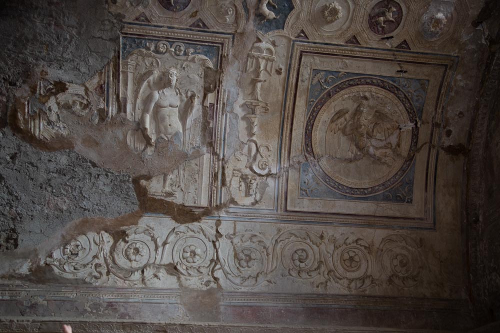 Italy, Pompeii,Forum Baths, view of the Tapidaruim with coloured stucco and shelves separated by telamones12