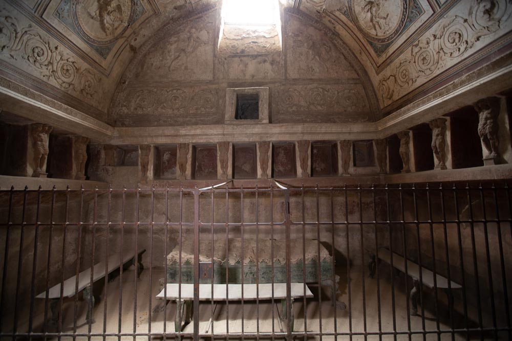 Italy, Pompeii,Forum Baths, view of the Tapidaruim with coloured stucco and shelves separated by telamones15