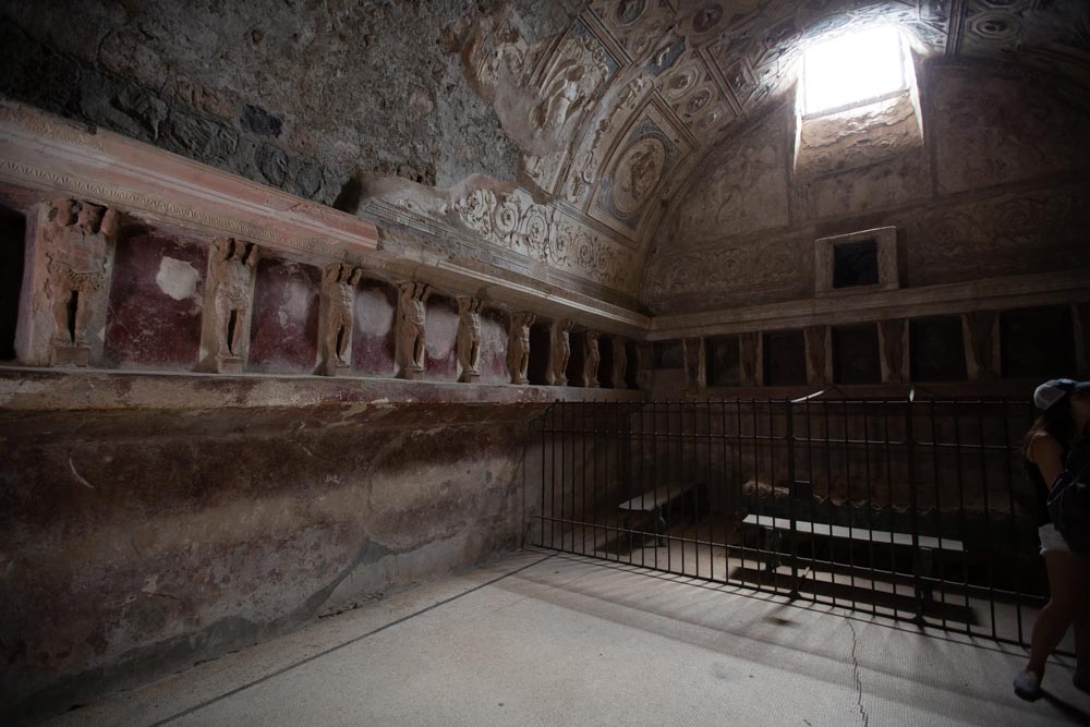 Italy, Pompeii,Forum Baths, view of the Tapidaruim with coloured stucco and shelves separated by telamones18