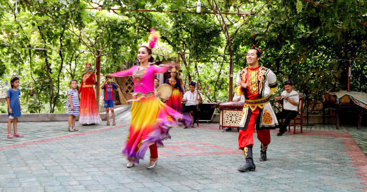 China, Turpan - traditional Uyghurs singing and dancing