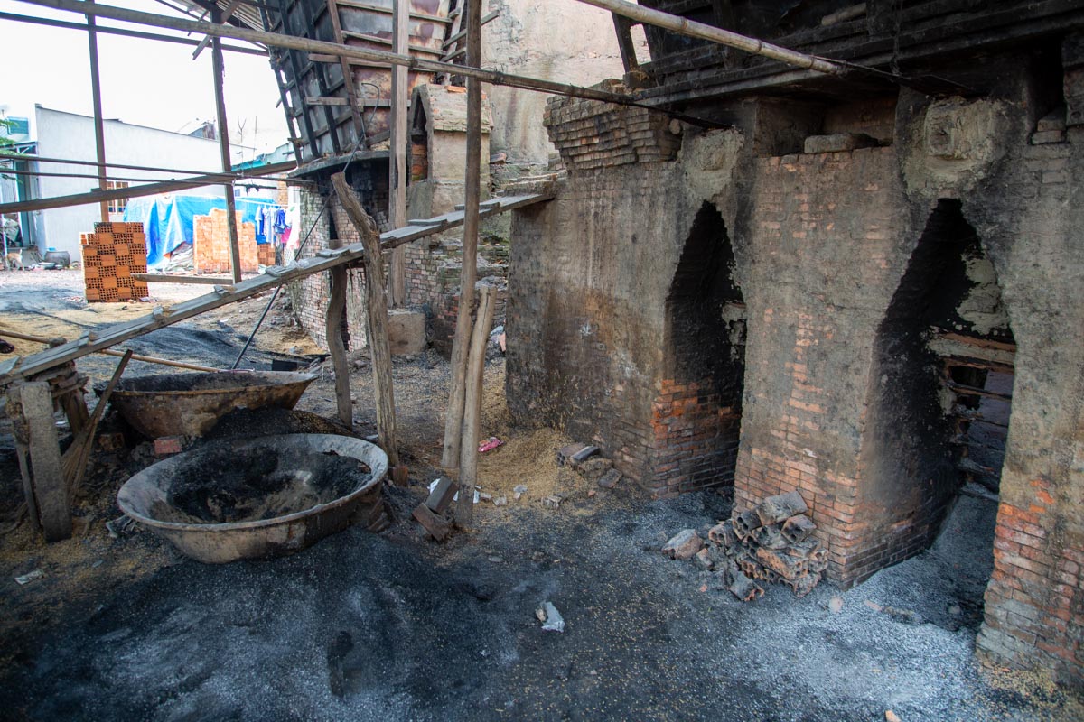 Vietnam, Mekong river - Storage of combustion material of rice chaff