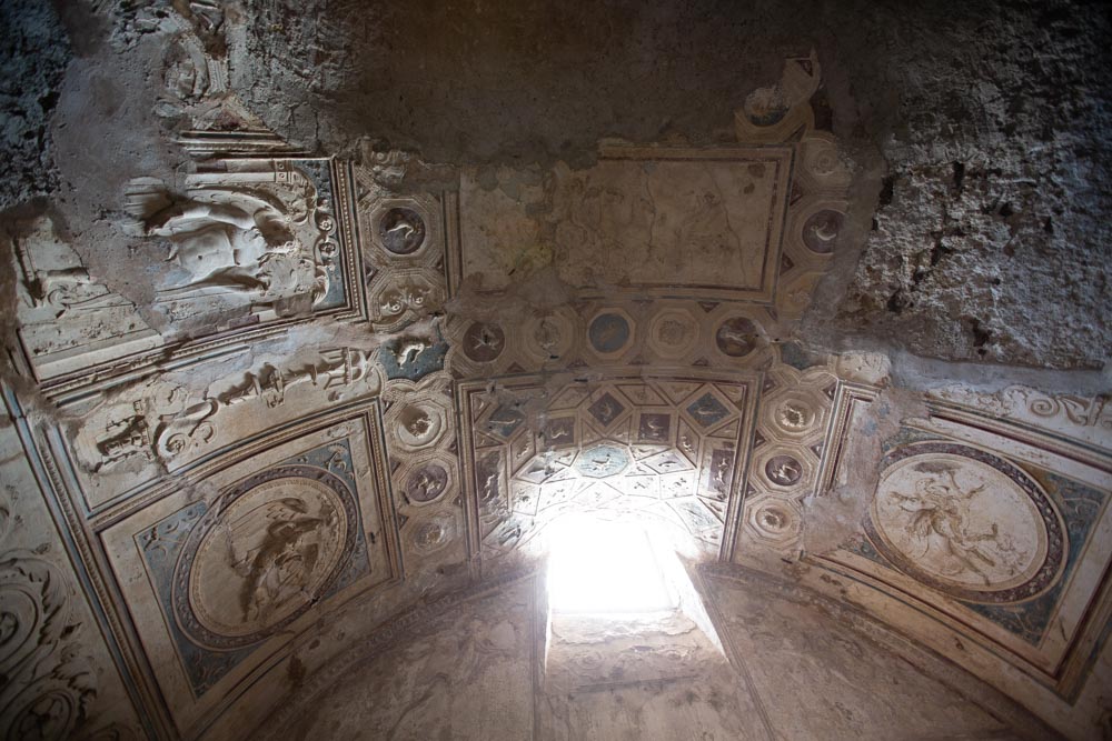 Italy, Pompeii, Forum Baths, view of the Tapidaruim with coloured stucco and shelves separated by telamones