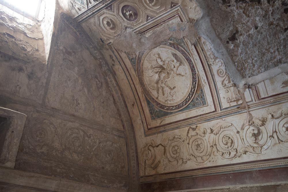 Italy, Pompeii, Forum Baths, view of the Tapidaruim with coloured stucco and shelves separated by telamones