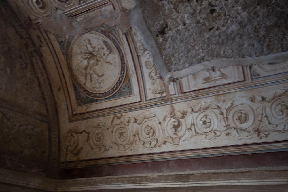 Italy, Pompeii, Forum Baths, view of the Tapidaruim with coloured stucco and shelves separated by telamones
