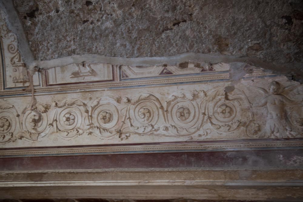 Italy, Pompeii, Forum Baths, view of the Tapidaruim with coloured stucco and shelves separated by telamones