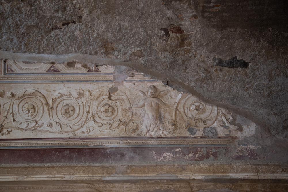Italy, Pompeii, Forum Baths, view of the Tapidaruim with coloured stucco and shelves separated by telamones