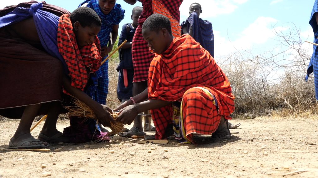 Tanzania, Maasai people lighting a fire
