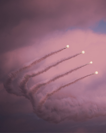 Interceptor trails over cloud