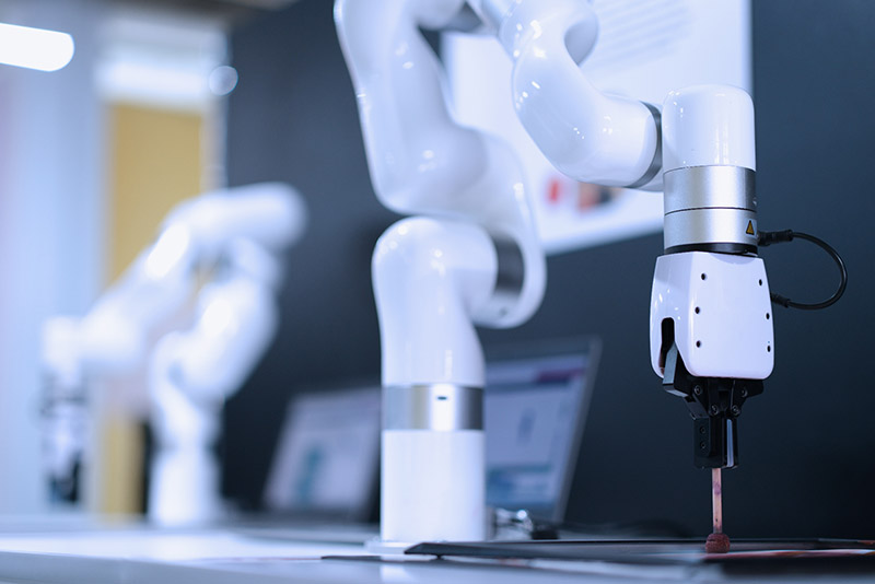 Robotic arms on an automated production line