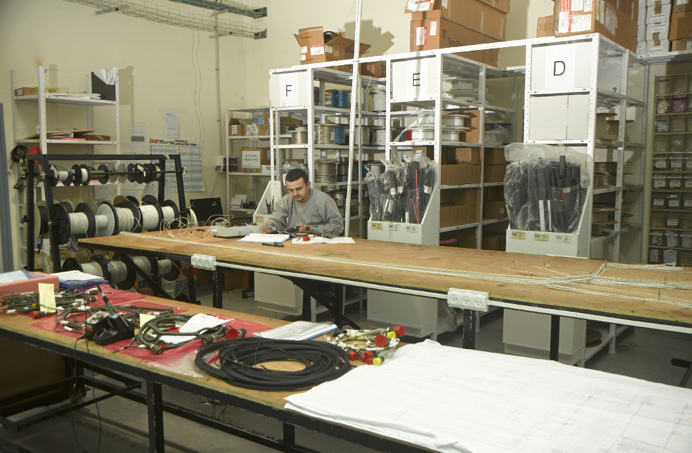 Assembly hall with pods lined up on work stands