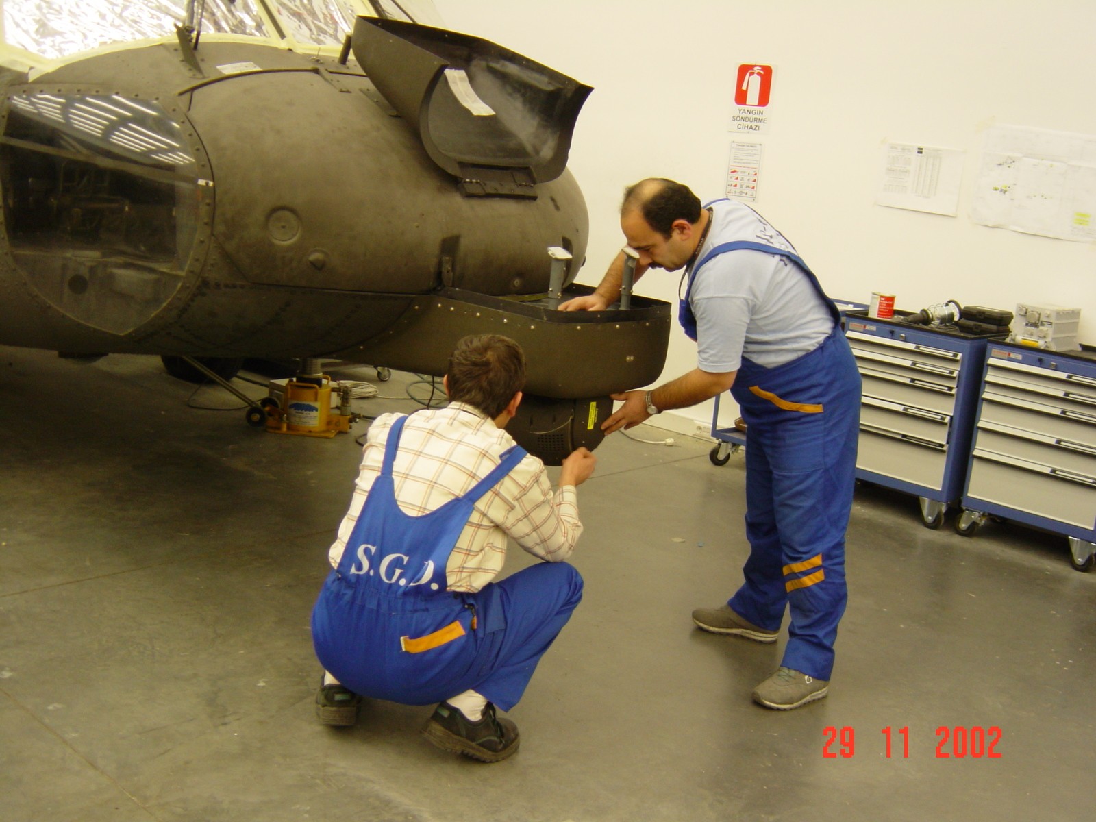 S.G.D technicians working on a helicopter upgrade