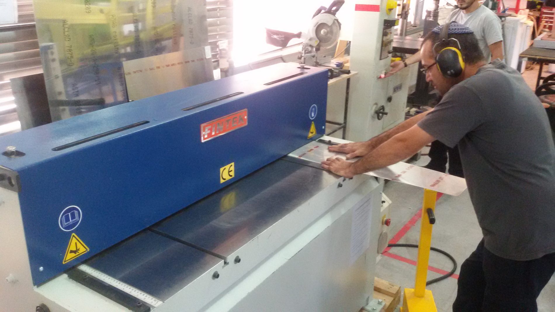 Blue CNC machining centre on the production floor