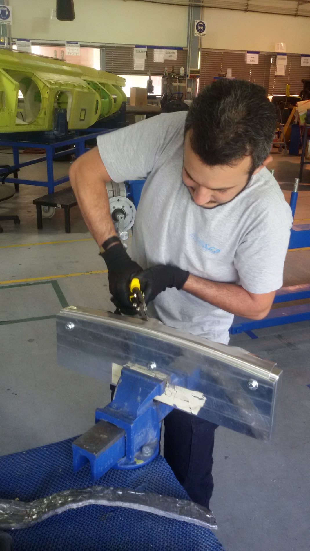 Technician riveting an aircraft structural part