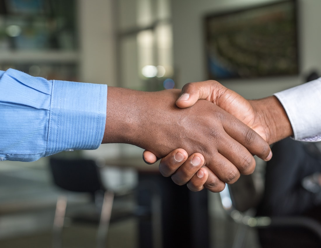 Business partners shaking hands in an office