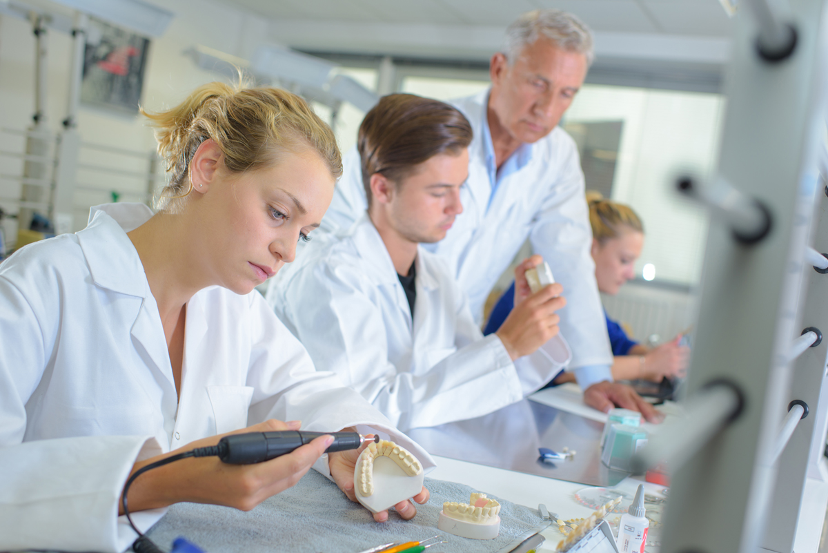 A Clinical Dental Technician at work at The Denture Shop