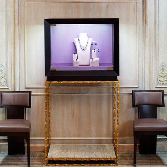 Mahogany cabinets, pink silk backdrops and a brass antique finish to the stands all went to creating a very classical look.