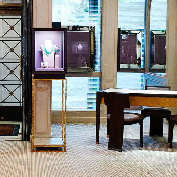 Small mahogany cabinet on side of store entrance, creating a very classical look.