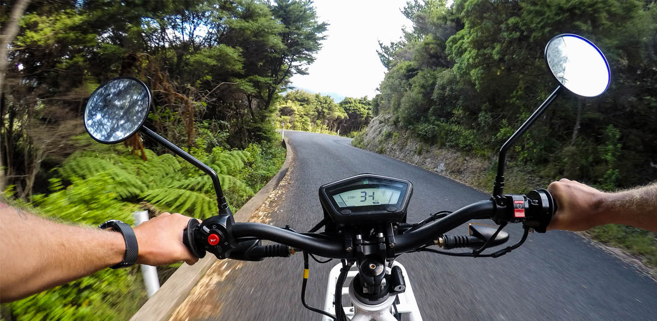 Riders stopped at a Great Barrier Island lookout