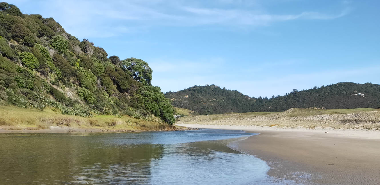 Electric motorbike beside the water at Great Barrier Island