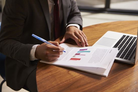 Businessman with supporting documentation