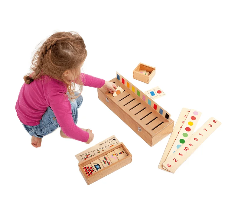 A child playing with a Doron Layeled wooden game