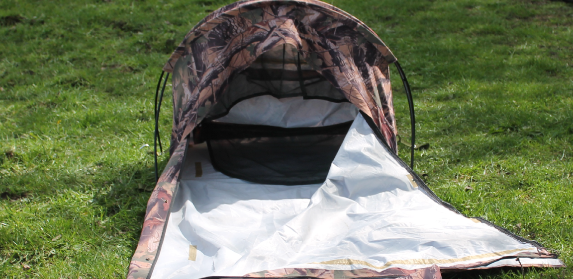 Side view of Sniperhide fully unzipped along its length. This allows the shooter to gain access to the hide from the side. The full length zipper has an orange pull cord attached to zip up once inside.