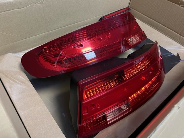 On offer is a full set of Aston Martin Vantage V8/V12 Rear Lights in Red. The set comprises of the left and right cluster and the boot lid brake light. Fixings/ Seals may be required if you don’t have them. They are in excellent clean working order with no scratches or damage to the lenses and have never had any condensation problems. Ready for shipping unless collection is preferred. £1150.00