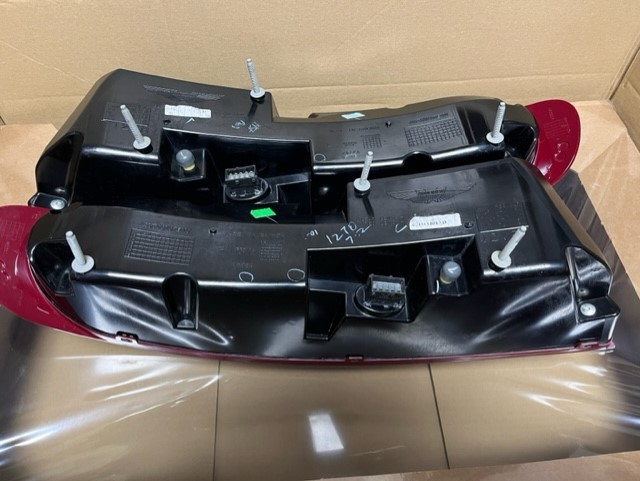 On offer is a full set of Aston Martin Vantage V8/V12 Rear Lights in Red. The set comprises of the left and right cluster and the boot lid brake light. Fixings/ Seals may be required if you don’t have them. They are in excellent clean working order with no scratches or damage to the lenses and have never had any condensation problems. Ready for shipping unless collection is preferred. £1150.00