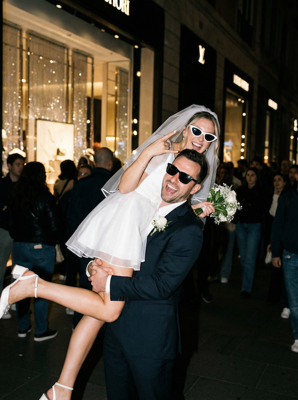 Direct flash wedding photos showcasing a joyful street celebration