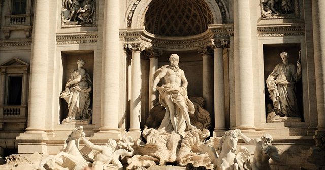 A detailed view of the iconic Trevi Fountain in Rome, showcasing its Baroque-style sculptures and architecture.