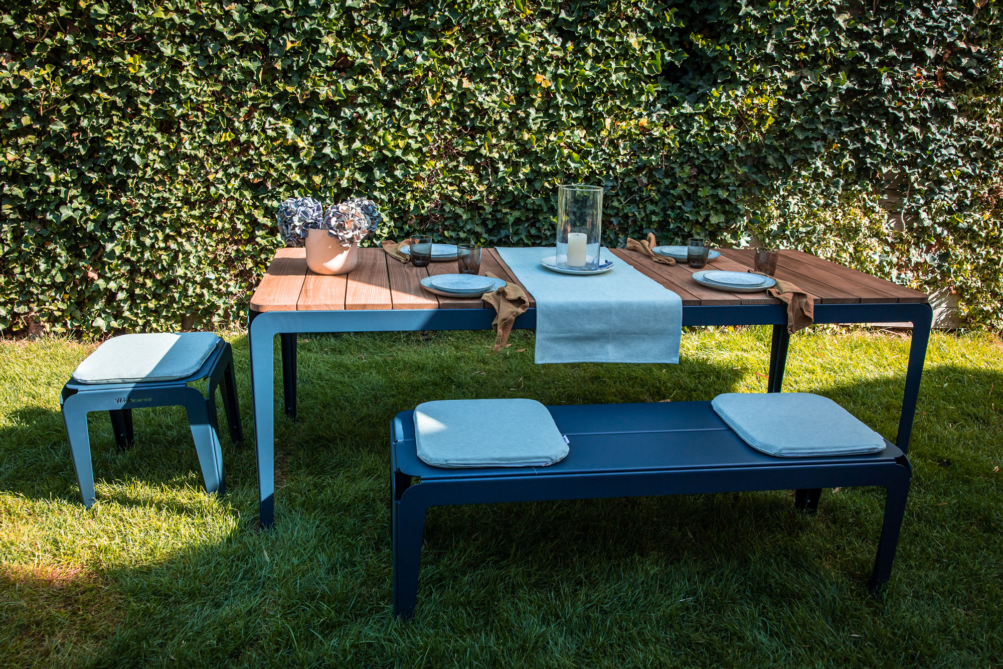 Weltevree-bended-table-wood-dining-outside-blue