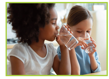 image of two children drinking water from a glass