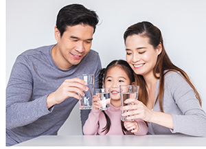 image of family drinking clean water