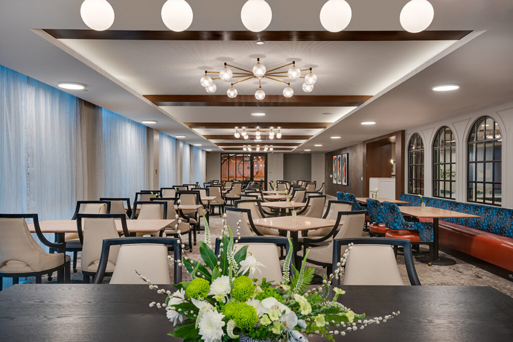 dining room with flowers on the table