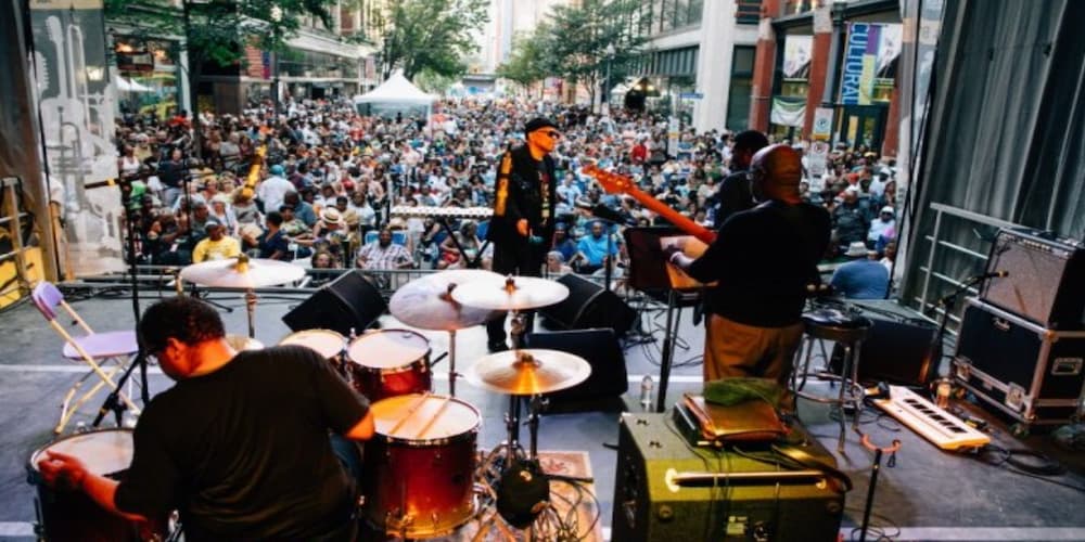 A group of people enjoying jazz music outside, music festivals in Pittsburgh, PA